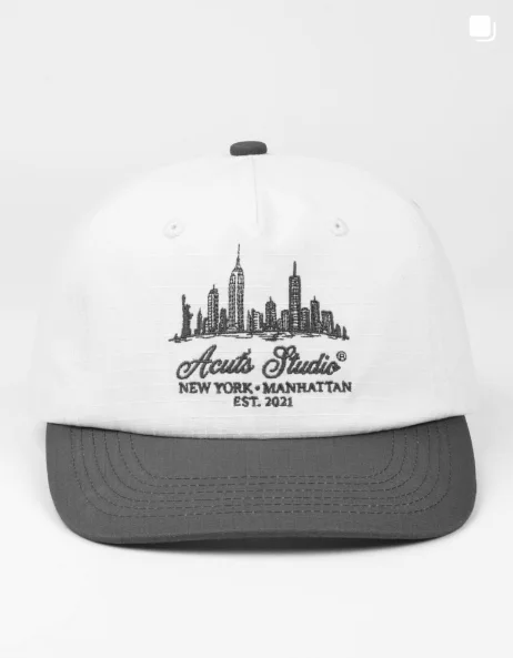 White and dark-brim ACUTS Studio New York skyline cap