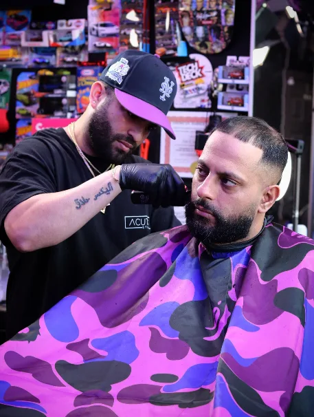 Barber detailing a client's beard with precision