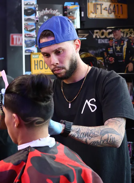 Barber executing a precise fade haircut